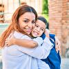 Mother and son hugging