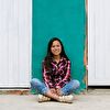 Teenager girl sitting on the ground