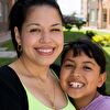 Mother and daughter smiling