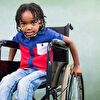 Boy sitting in a wheelchair