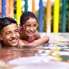 Brother and sister playing in the swimming pool