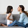 Mother and daughter smiling and talking