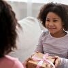 Daughter giving a gift her mother