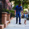 Father walking on the street with daughter