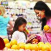 Mother and daughter shopping while watching the tablet