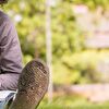 A boy lying on the ground and writing